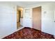 Sunroom with parquet floor, open doorway to kitchen and exterior door at 1318 Preston S St, St Petersburg, FL 33712
