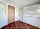 Bright sunroom with wood-look flooring, window blinds, and exterior access at 1318 Preston S St, St Petersburg, FL 33712