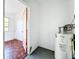 Unfinished laundry room with water heater and access to other rooms at 1318 Preston S St, St Petersburg, FL 33712
