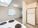 Efficient kitchen with white cabinets and wood-look countertops at 1318 Preston S St, St Petersburg, FL 33712