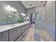 Modern bathroom with double vanity and a large walk-in shower at 998 Signet Dr, Apollo Beach, FL 33572