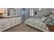 Bedroom with white dresser and stylish bedding at 998 Signet Dr, Apollo Beach, FL 33572