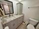 Updated bathroom with a vanity, toilet, and shower at 4895 Bay Ne St # 215, St Petersburg, FL 33703