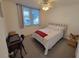 Cozy guest bedroom with a full-size bed and a workspace at 4895 Bay Ne St # 215, St Petersburg, FL 33703