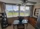 Bright kitchen nook with stainless steel refrigerator and view at 4895 Bay Ne St # 215, St Petersburg, FL 33703