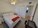 Cozy guest bedroom with a full-size bed and a workspace at 4895 Bay Ne St # 215, St Petersburg, FL 33703