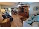 Living room with hardwood floors, furniture, and a dining area at 4895 Bay Ne St # 215, St Petersburg, FL 33703