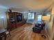 Living room with hardwood floors, furniture, and access to balcony at 4895 Bay Ne St # 215, St Petersburg, FL 33703