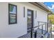 Modern entryway with glass door and balcony at 12400 Capri N Cir # B, Treasure Island, FL 33706