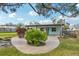 Charming single story home with a landscaped yard and walkway at 1265 Magnolia Dr, Clearwater, FL 33756