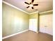 Spacious bedroom with tile flooring, ceiling fan, closet and additional storage space at 15810 Cobble Mill Dr, Wimauma, FL 33598