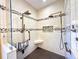 Elegant tiled shower featuring dual shower heads, built-in seat, and glass enclosure at 15810 Cobble Mill Dr, Wimauma, FL 33598