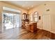 Cozy bar area featuring a granite countertop, bar stools, and a view of the pool at 168 Rue Des Chateaux, Tarpon Springs, FL 34688
