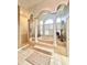 Luxurious bathroom featuring a soaking tub with columns and a walk-in shower at 168 Rue Des Chateaux, Tarpon Springs, FL 34688