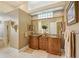 Elegant bathroom with granite countertops, dual sinks, large mirror, and decorative wall sconces at 168 Rue Des Chateaux, Tarpon Springs, FL 34688