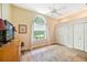 Bright bedroom offering a spacious layout, large window, and closet storage, providing a serene retreat at 168 Rue Des Chateaux, Tarpon Springs, FL 34688