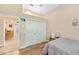 This bedroom features a closet and wood floors offering a cozy and stylish space to relax at 168 Rue Des Chateaux, Tarpon Springs, FL 34688