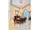Formal dining room with a chandelier, large mirror, and a traditional dining table at 168 Rue Des Chateaux, Tarpon Springs, FL 34688