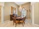 Formal dining room with elegant table, chandelier, and decorative accents at 168 Rue Des Chateaux, Tarpon Springs, FL 34688