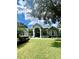 Elegant home with a grand entrance and manicured lawn at 168 Rue Des Chateaux, Tarpon Springs, FL 34688