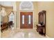 Elegant foyer with marble floors, a chandelier, and decorative accents at 168 Rue Des Chateaux, Tarpon Springs, FL 34688