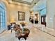 Grand foyer featuring marble floors, elegant furnishings, and a view of the dining room at 168 Rue Des Chateaux, Tarpon Springs, FL 34688