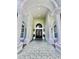 Elegant entrance featuring stately columns, arched transom, and tiled walkway at 168 Rue Des Chateaux, Tarpon Springs, FL 34688
