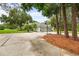 Charming home featuring a three-car garage and a basketball hoop on a well-manicured lawn at 168 Rue Des Chateaux, Tarpon Springs, FL 34688