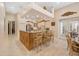 Open kitchen with granite countertops, a large island, and seating at 168 Rue Des Chateaux, Tarpon Springs, FL 34688