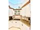 Eat-in kitchen features granite countertops, tile backsplash, and custom cabinets at 168 Rue Des Chateaux, Tarpon Springs, FL 34688