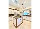 Open-concept kitchen with an island, stainless appliances, and granite countertops at 168 Rue Des Chateaux, Tarpon Springs, FL 34688