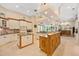 Spacious kitchen featuring dual islands, custom cabinetry, and modern appliances at 168 Rue Des Chateaux, Tarpon Springs, FL 34688