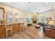 Inviting living room with a fireplace, bar, and hardwood floors at 168 Rue Des Chateaux, Tarpon Springs, FL 34688