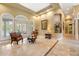 Spacious living room with tile floors, high ceilings, recessed lighting, and access to an outdoor area at 168 Rue Des Chateaux, Tarpon Springs, FL 34688