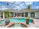 Inviting outdoor pool and patio area with stylish seating and lush landscaping, perfect for relaxation and entertainment at 168 Rue Des Chateaux, Tarpon Springs, FL 34688