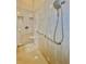 Shower stall with tile walls, seating, and grab bars at 168 Rue Des Chateaux, Tarpon Springs, FL 34688