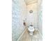 Toilet room with decorative features and neutral color palette at 168 Rue Des Chateaux, Tarpon Springs, FL 34688