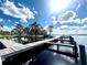 Expansive lakefront dock system with multiple slips, providing ample boat parking at 168 Rue Des Chateaux, Tarpon Springs, FL 34688