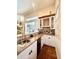 Convenient wet bar with granite counters, wine storage, and cabinetry for easy entertaining at 168 Rue Des Chateaux, Tarpon Springs, FL 34688