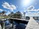 Expansive lakefront dock system with multiple slips, providing ample boat parking at 168 Rue Des Chateaux, Tarpon Springs, FL 34688