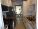 Bright kitchen with granite countertops and stainless steel appliances at 3128 59Th S St # 209, Gulfport, FL 33707