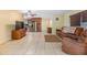 Spacious living room featuring tile floors and a view into the kitchen at 35204 Ponderosa Rd, Zephyrhills, FL 33541