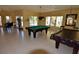 Entertaining game room featuring a pool table, piano, and seating area at 4336 Bayside Village Dr # 201, Tampa, FL 33615