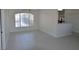 Bright living room featuring a large window, tile flooring, and neutral paint colors at 4336 Bayside Village Dr # 201, Tampa, FL 33615
