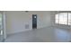 Spacious living room with tiled floors, neutral walls and glass doors at 4336 Bayside Village Dr # 201, Tampa, FL 33615