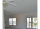 Bright living room featuring sliding glass doors for natural light and access to outdoor spaces at 4336 Bayside Village Dr # 201, Tampa, FL 33615