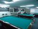 Well-lit billiards room with multiple pool tables at 3128 59Th S St # 209, Gulfport, FL 33707