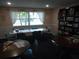 Relaxing game room with tables, chairs, and a large bookshelf at 3128 59Th S St # 209, Gulfport, FL 33707
