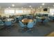 Community room with tables and chairs, perfect for gatherings at 3128 59Th S St # 209, Gulfport, FL 33707