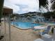 Relaxing community pool with lounge chairs and patio tables at 3128 59Th S St # 209, Gulfport, FL 33707